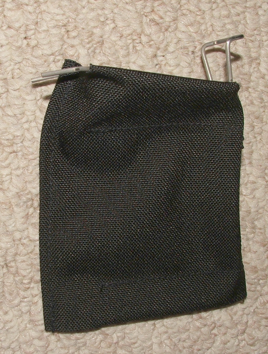 Figure 6 — A brass catcher fitted over the ejection chute. The pouch hangs directly beneath the weapon because that is the direction the cases travel.