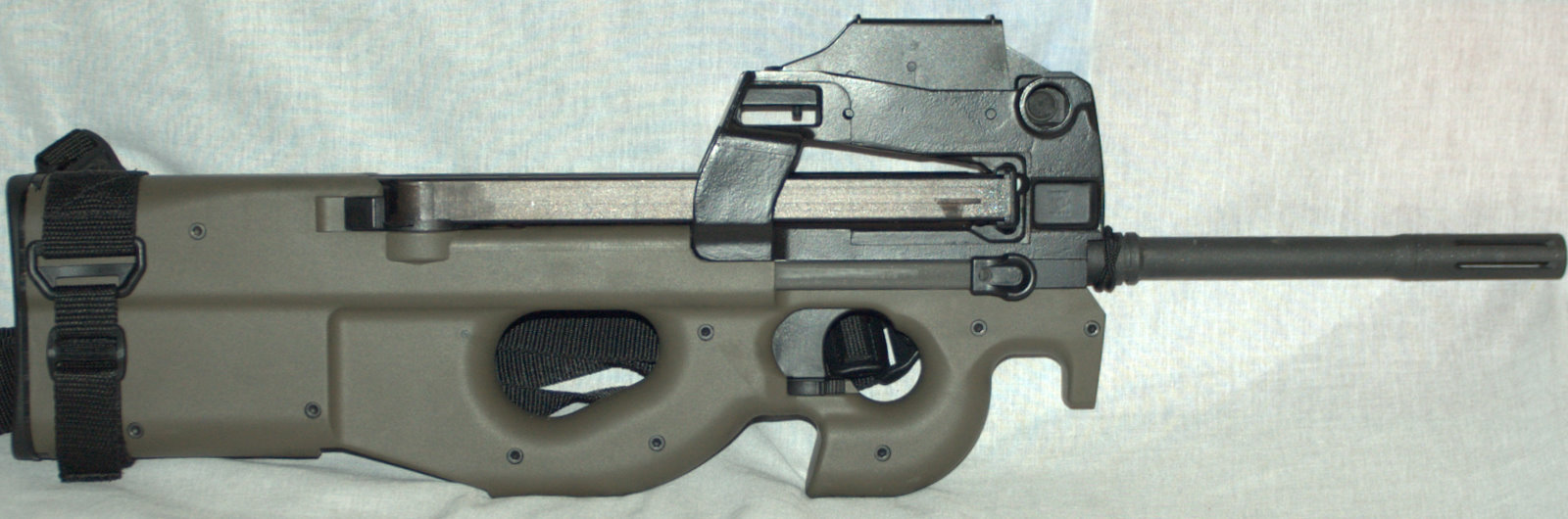 Figure 12 — The PS90 for direct comparison with the P90 photographs above. The barrel running far forward of the shell is the tell that decides every caption in these volumes.