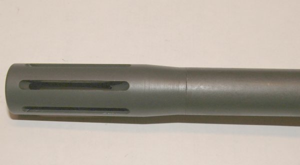 Figure 3 — The PS90's ported muzzle brake at the end of the long barrel. The muzzle device is the second identification tell after barrel length.