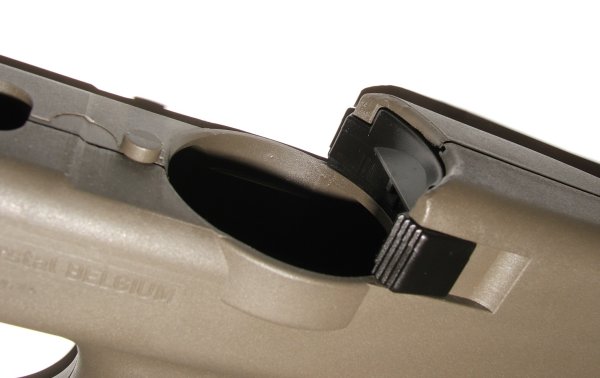 Figure 3 — The magazine release, behind the magazine well on the top of the shell. It is reachable with either hand, which is part of the weapon's genuine ambidexterity.