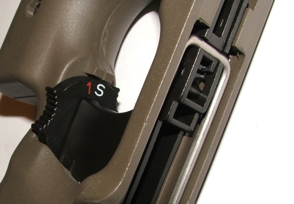 Figure 2 — The PS90's selector dial, marked "1" and "S" and nothing else. This is the definitive photographic evidence that separates a civilian PS90 from a military P90, and it is worth more than any other i…