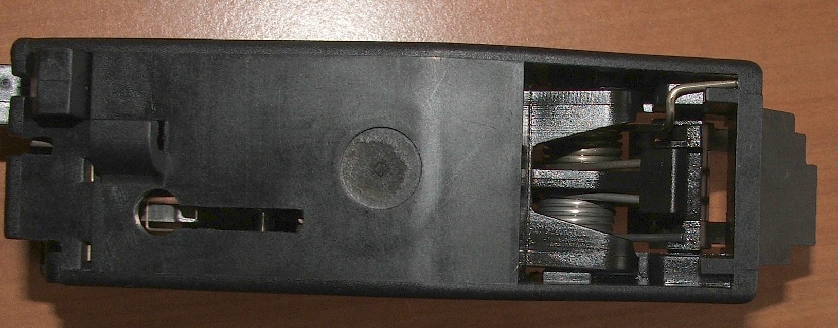Figure 4 — The fire-control group opened. Work on a bullpup trigger is work on the linkage and its bearing surfaces as much as on the sear itself.