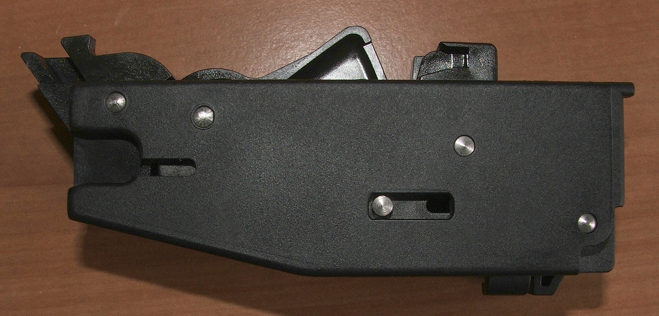 Figure 10 — The magazine and its rollers alongside the fire-control components. Both are mechanisms the owner will handle regularly, and both reward being kept clean.