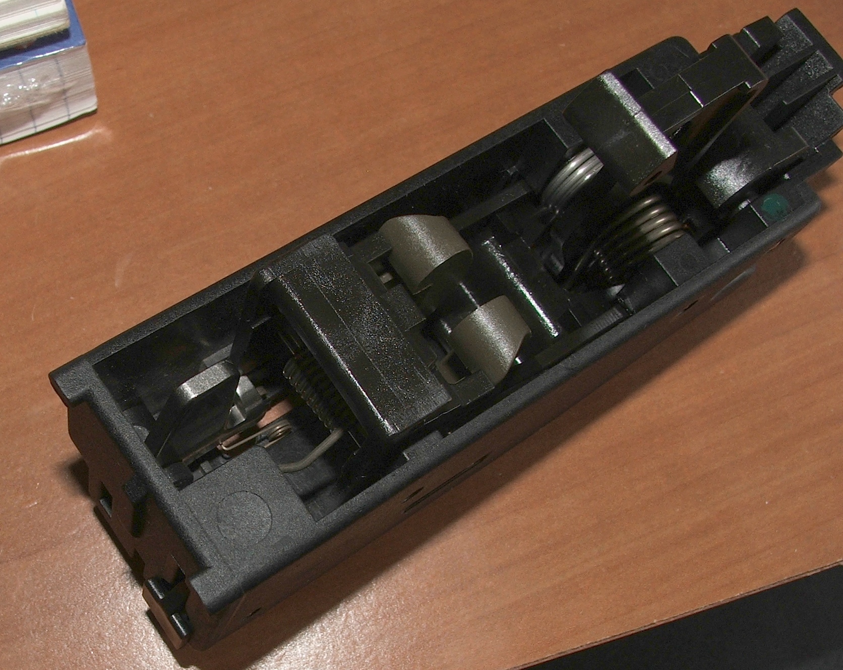 Figure 8 — The fire-control group seen from another angle. The mechanism is accessible for cleaning and inspection; FN's position is that anything beyond that belongs to a service centre or an armorer.