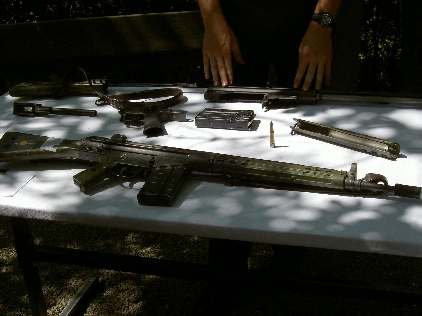 Figure 5 — The parts of a G3 field strip photographed on a bench: receiver with barrel, bolt group, end cap and stock, grip, handguard and magazine.