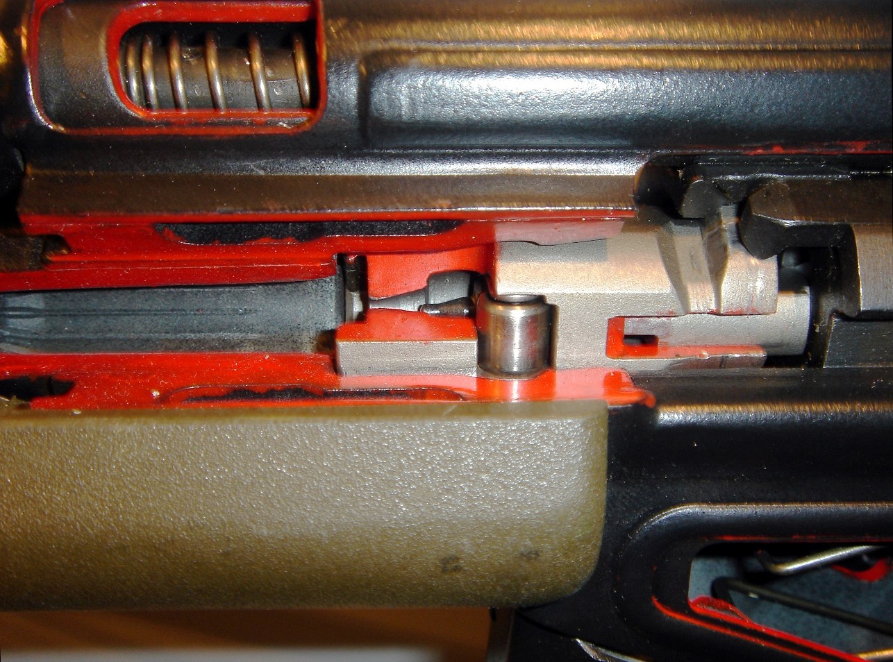 Figure 2 — A sectioned G3, painted for instruction, showing the bolt and roller area inside the receiver and the recoil spring above it.