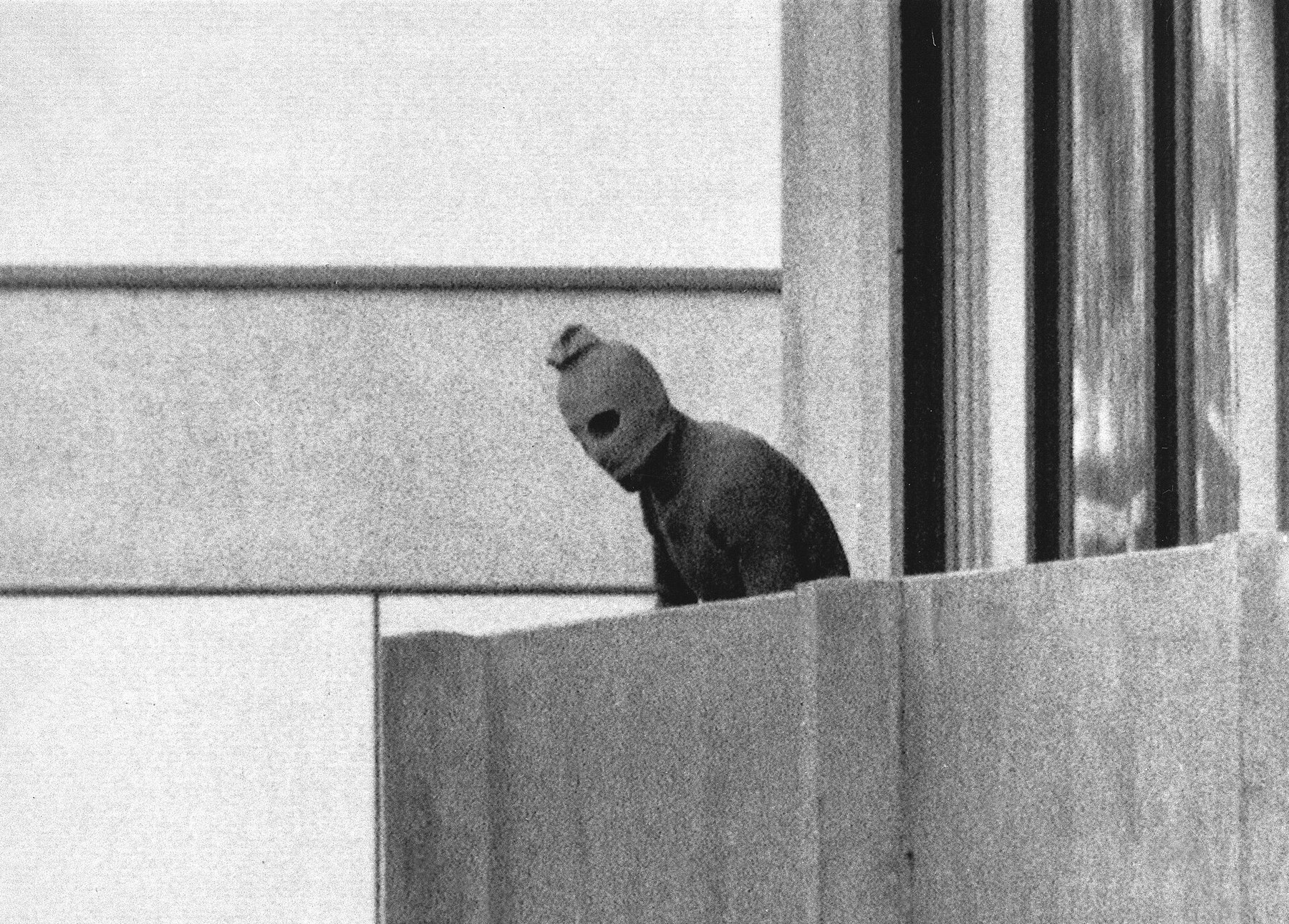 Figure 2 — A member of the Black September group on the balcony of the Israeli team's quarters at Connollystraße 31 in the Olympic village, Munich, 5 September 1972. Photograph by Kurt Strumpf, Associated Pre…
