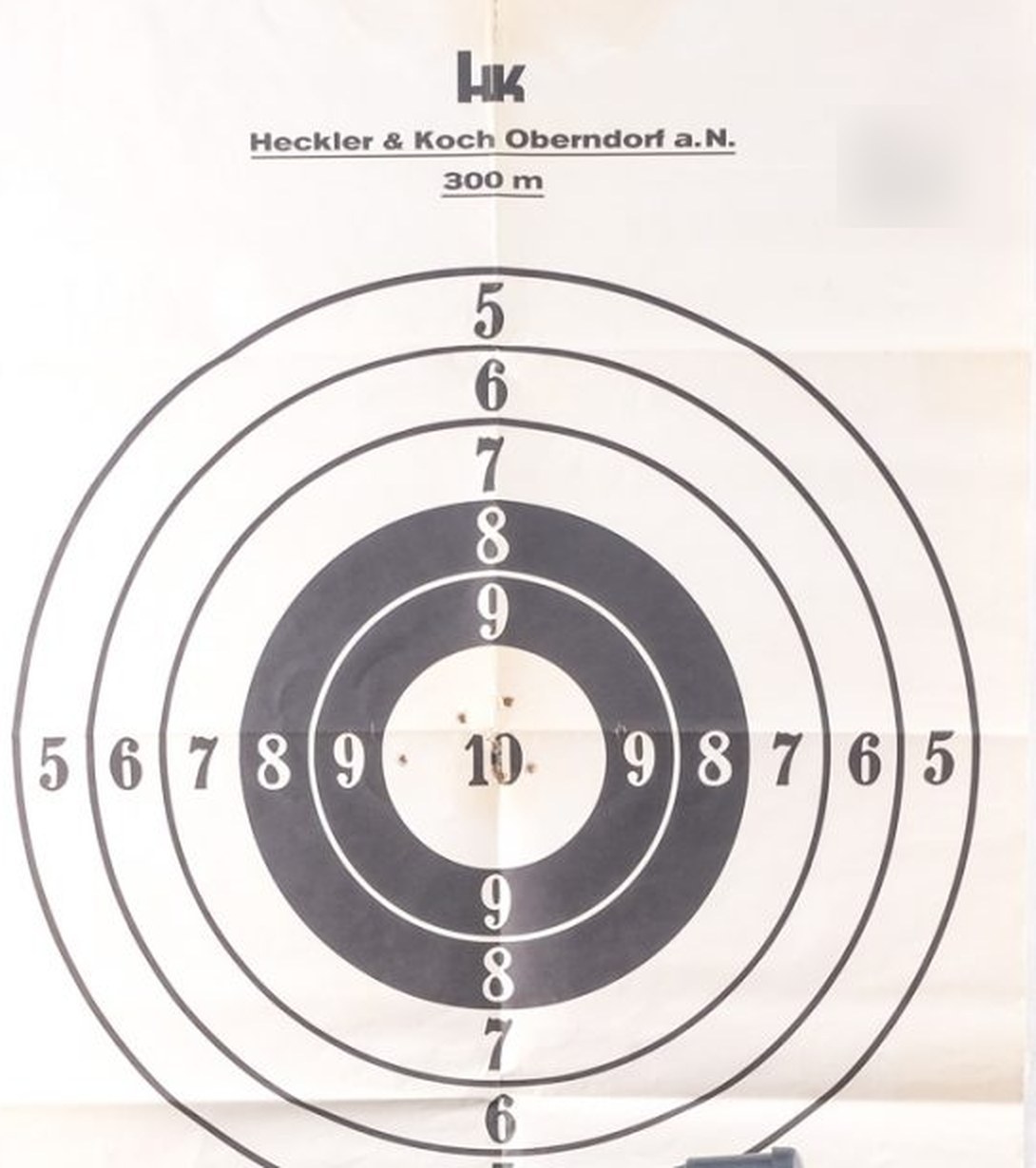 Figure 2 — A PSG1 factory test target as it came with a rifle sold at auction: H&K's printed sheet headed "Heckler & Koch Oberndorf a.N." and "300 m", with boxes for the weapon and telescope numbers (blurred …