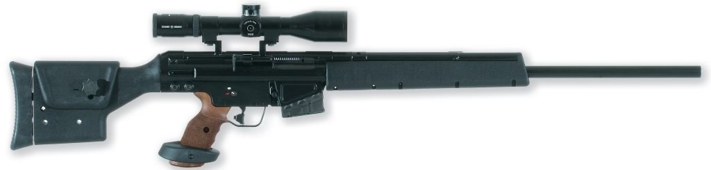 Figure 5 — A PSG1 A1, right side: the PSG1's box stock, stippled grip with palm shelf, heavy barrel and plain handguard, carrying a Schmidt & Bender telescope (the maker's name is on the objective bell) in pl…