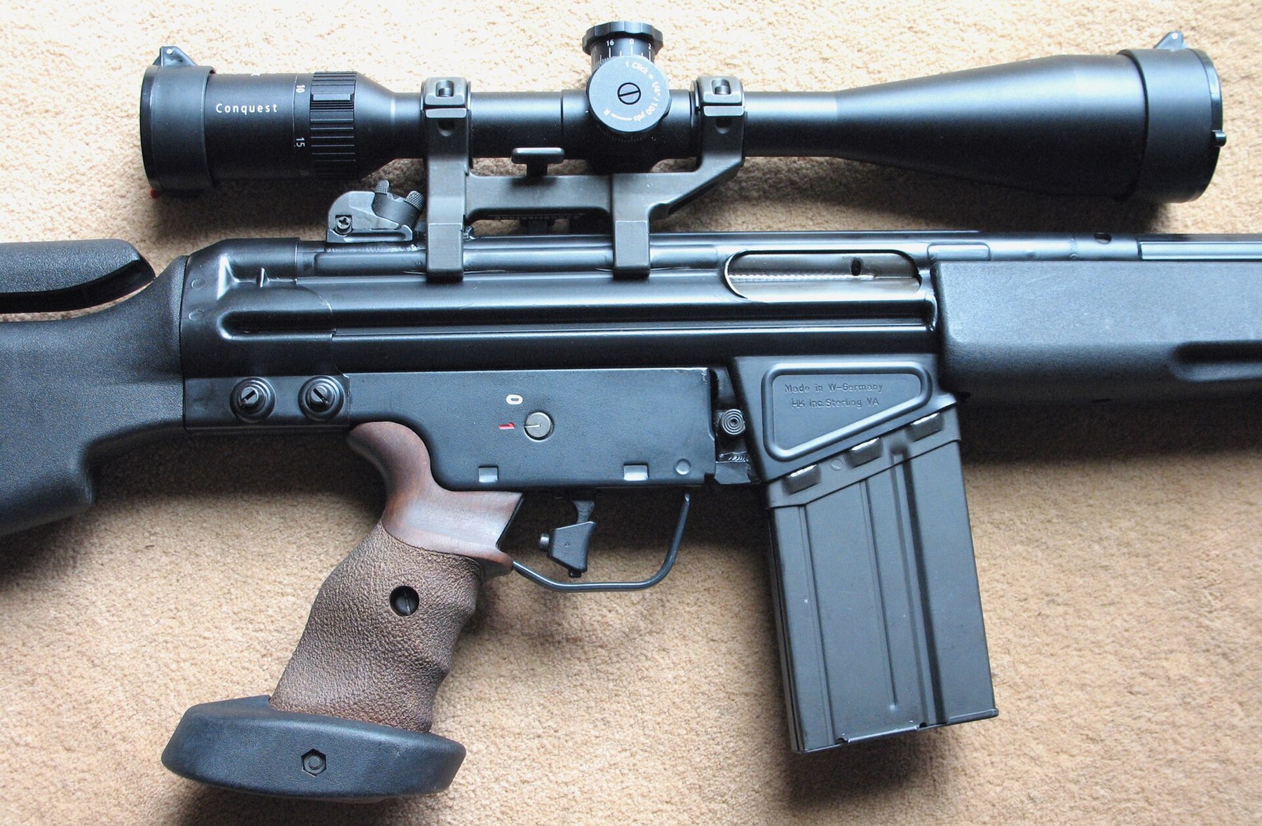 Figure 5 — An SR9T with a modern variable-power telescope on a claw mount clamped to the receiver's recesses.