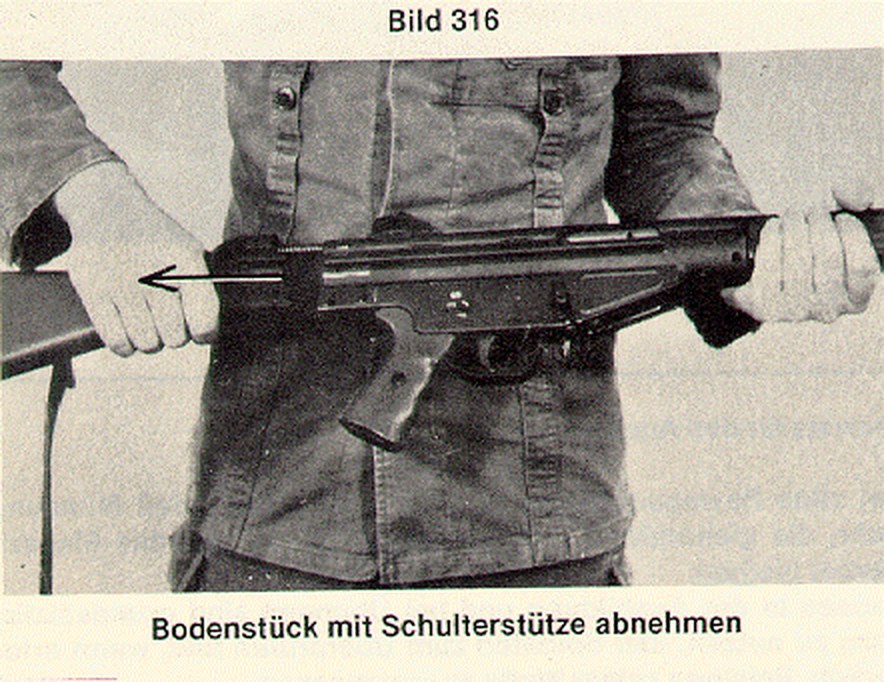 Figure 3 — The first step of the G3 field strip in the Bundeswehr regulation: with the two retaining pins out and stowed in the stock, the end cap and stock are drawn straight back off the receiver.