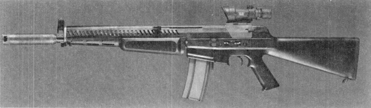Figure 3 — AAI's Advanced Combat Rifle with iron sight, as photographed for the US Army in 1989: a conventional-looking rifle descended from the SPIW flechette rifles, with a long sighting rib on top and a mu…