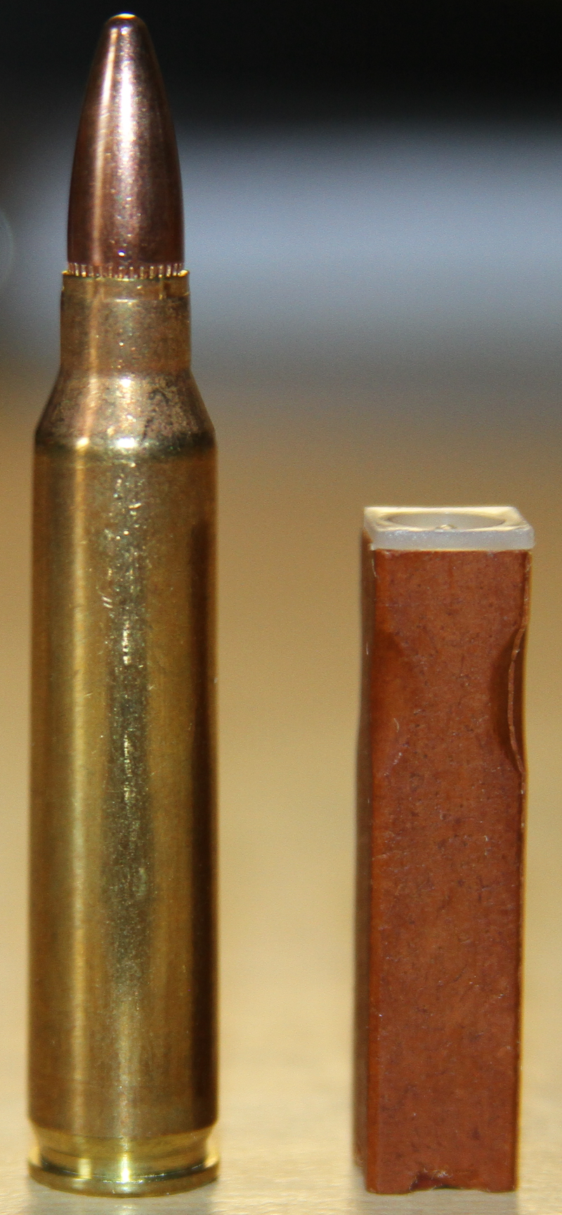 Figure 6 — A 4.73 × 33 mm caseless round (right) beside a .223 Remington cartridge (left), showing how much smaller and lighter the G11's round is than a conventional 5.56 mm cartridge. Der Spiegel put the G1…