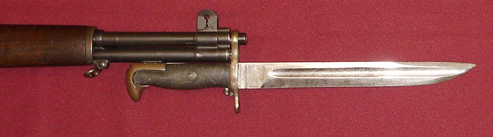 Figure 6 — A converted, "bowie"-pointed M1905 on an M1 — the fuller runs nearly to the tip. — Photograph: Curiosandrelics, CC BY-SA 4.0, via Wikimedia Commons.