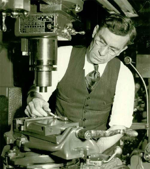 Figure 2 — Garand at a milling machine at Springfield Armory. The Park Service calls him "a hands-on weapons and production engineer," and the photograph makes the point: he designed rifles that could be made…