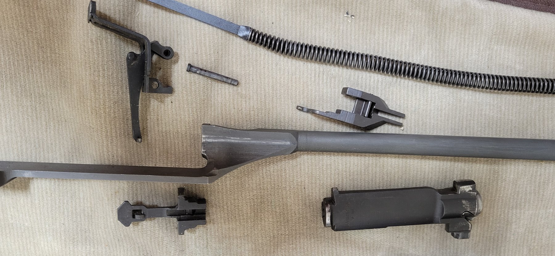 Figure 18 — The operating rod, bolt, follower rod and spring, operating rod catch and follower out of the rifle.