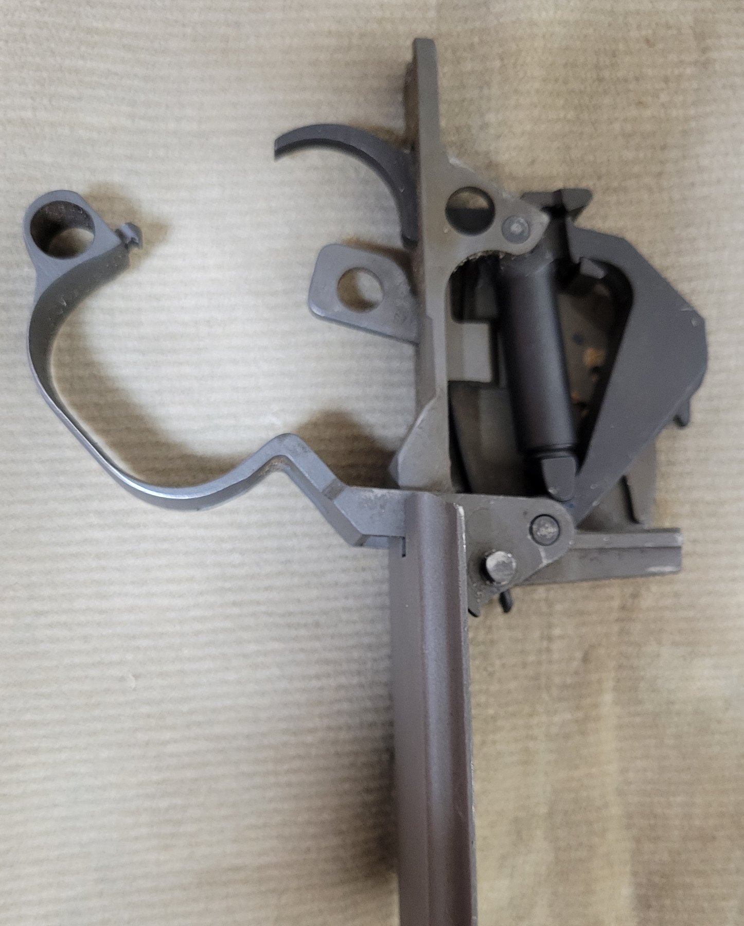 Figure 7 — The trigger group from the other side, showing the hammer, safety and trigger guard.