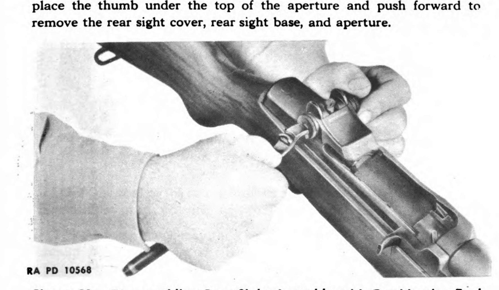 Figure 4 — Taking the rear sight apart with the combination tool. — U.S. War Department, TM 9-1275 (1942), Figure 29; public domain, via the Internet Archive.