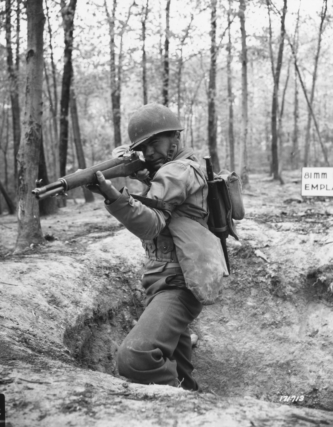 Figure 1 — An American infantryman firing an M1 in 1943. The original Signal Corps caption reads: "He counts on it for protection... to kill the enemy. It's the first thing he grabs when the alarm sounds and …