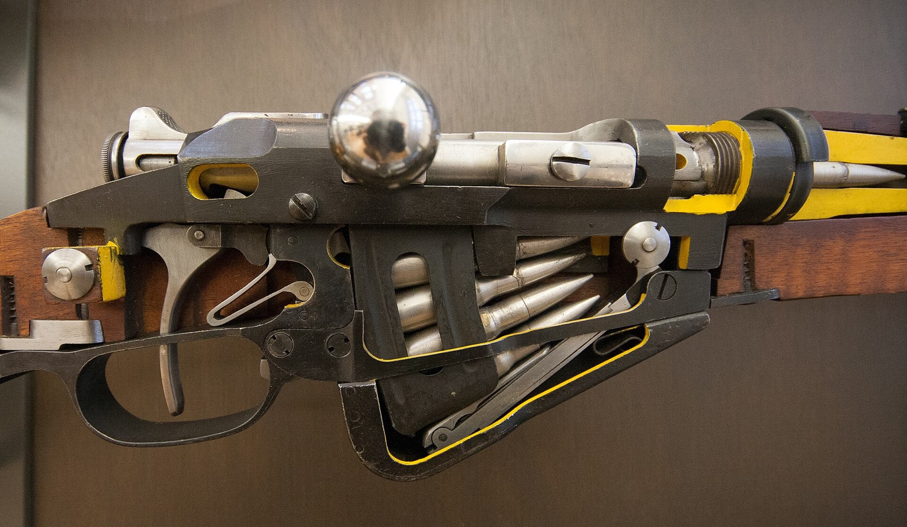 Figure 6 — A cutaway Berthier Mle 1916 carbine in the weapons department of the Musée d'Art et d'Industrie, Saint-Étienne, showing the bolt, trigger and the magazine's follower and spring. The Berthier is the…