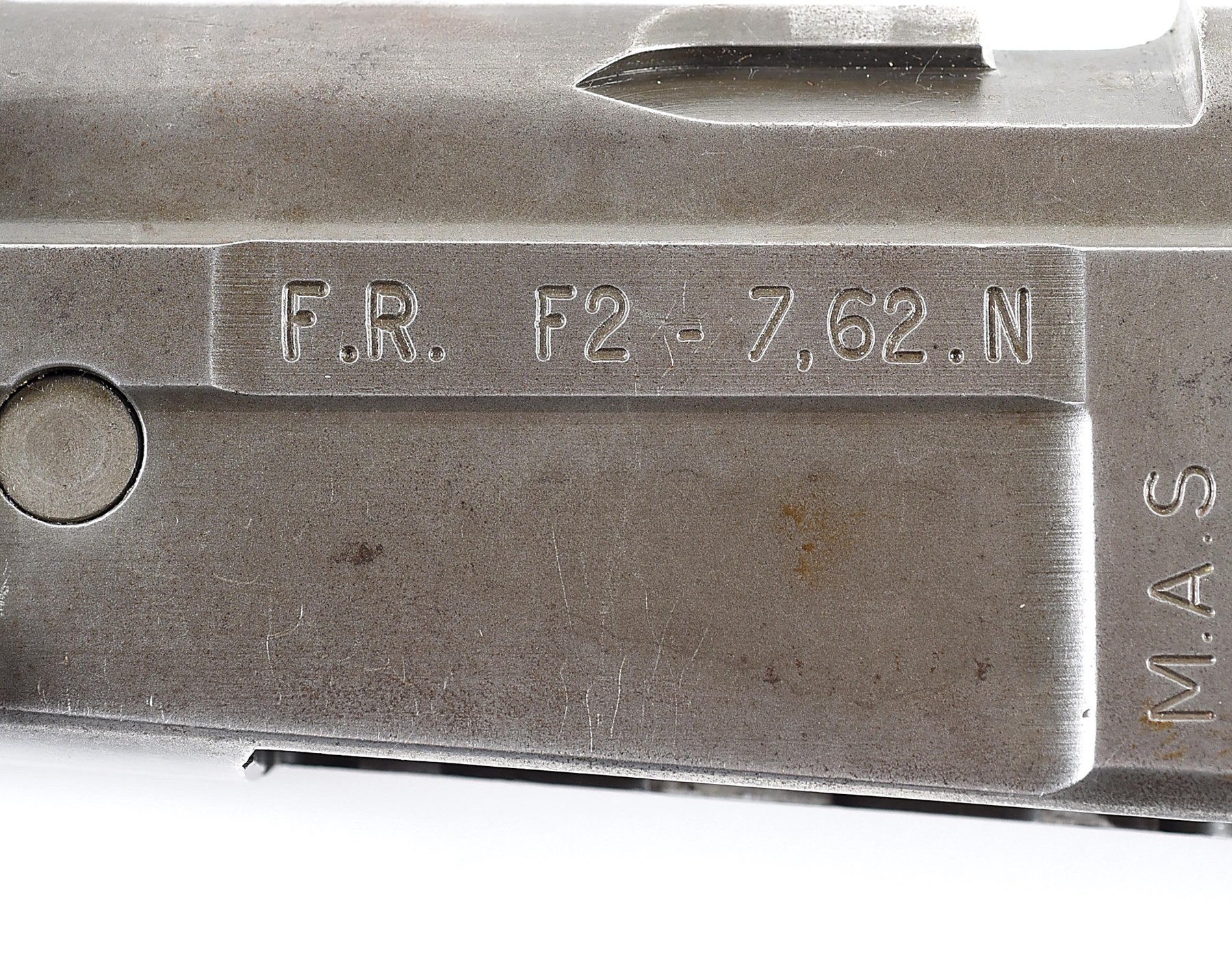 Figure 6 — The left side of an imported FR-F2's receiver, stamped "F.R. F2 - 7,62.N", with "M.A.S" for the Saint-Étienne arsenal stamped vertically at the rear. The serial number to the right of it is cropped…