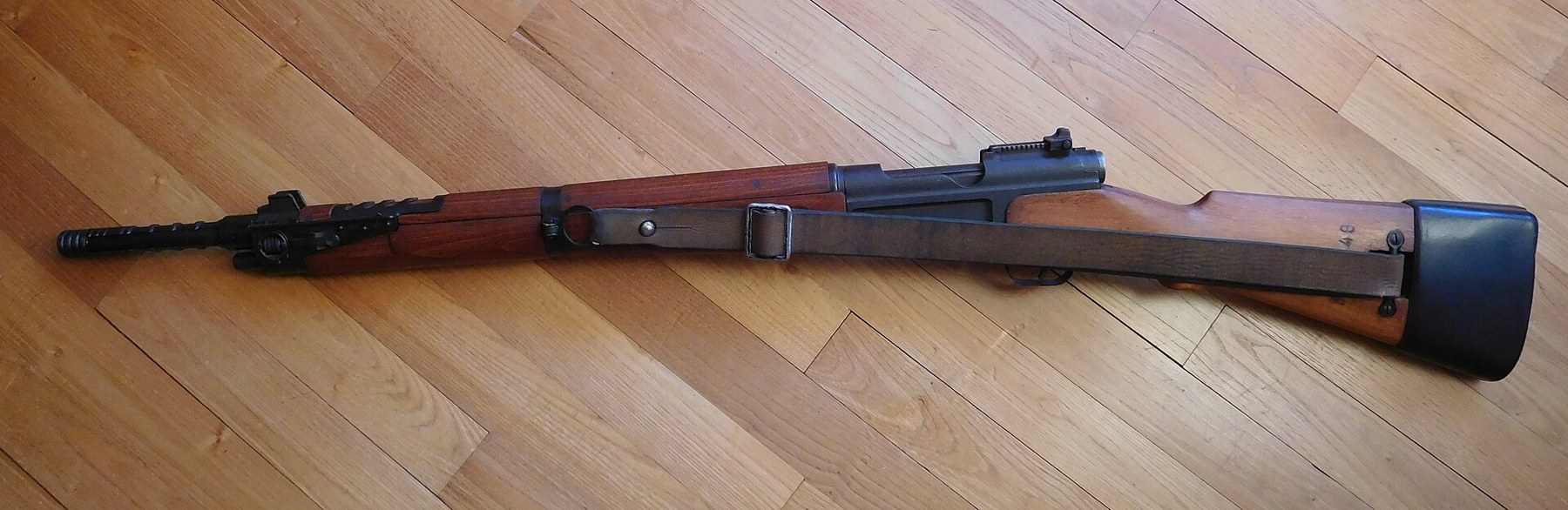 Figure 11 — A MAS 36/51, neutralised, with its sling. The 22 mm grenade launcher on the muzzle and the grenade sight set it apart from the plain MAS 36. Photograph by Cjp24, CC BY-SA 4.0, via Wikimedia Commons.