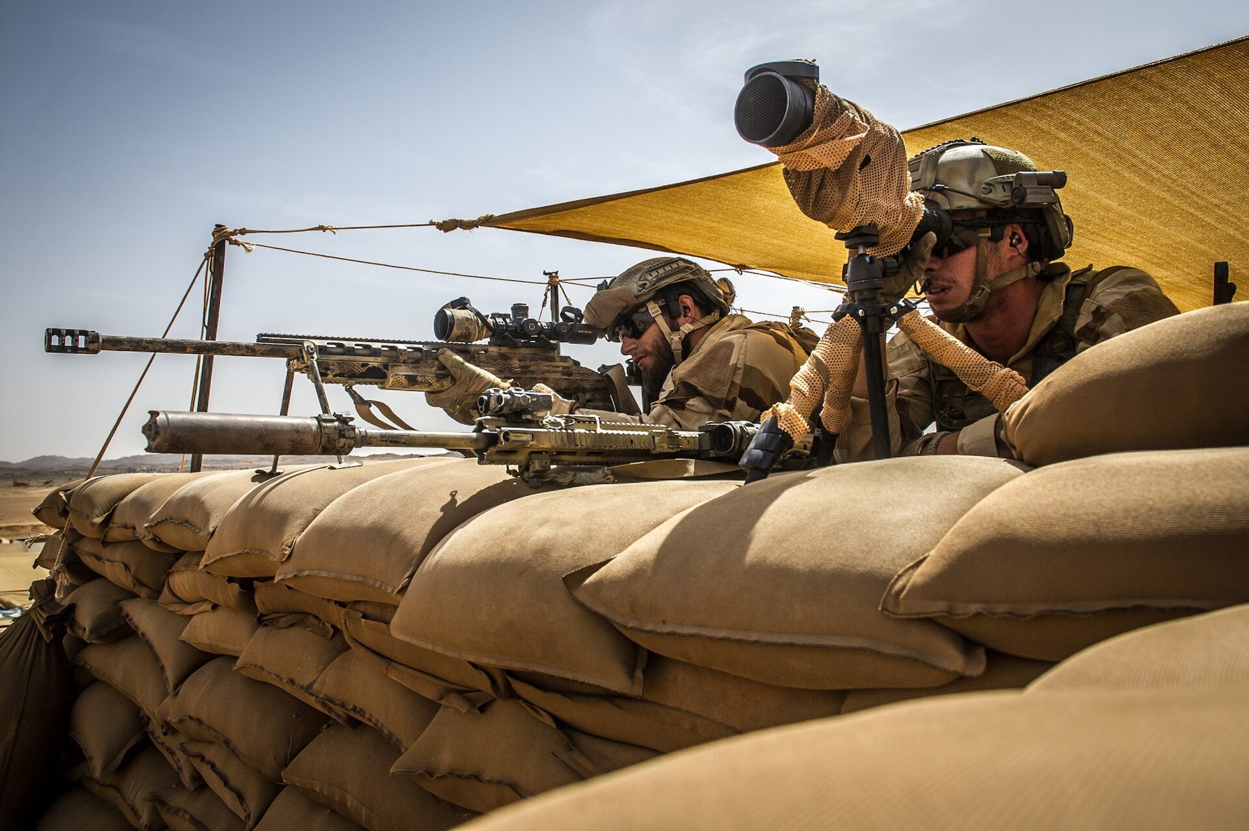 Figure 10 — A marksman of the 8e régiment parachutiste d'infanterie de marine, armed according to the Army's caption with a Sako TRG-42 in .338 Lapua Magnum, with his spotter in Mali during Opération Barkhane,…