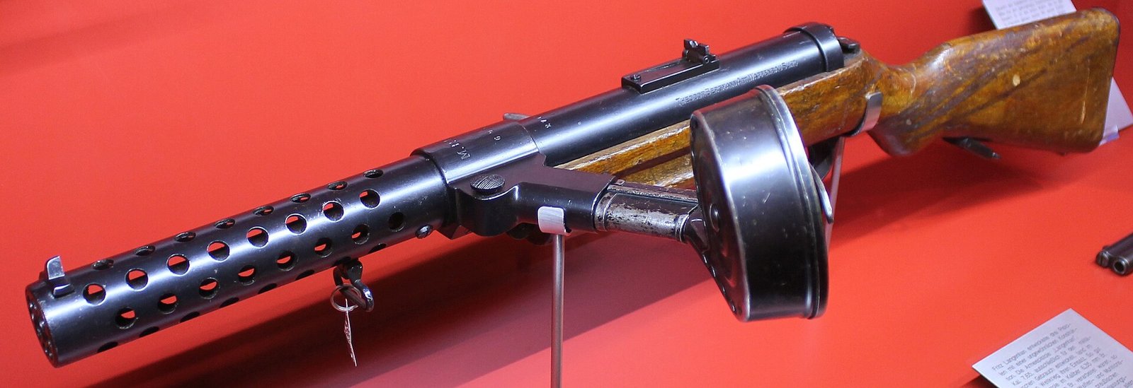 Figure 2 — An MP 18 at Suhl. This weapon is Schmeisser's, and it is a genuinely foundational object — the reference literature records that it "formed the basis of most submachine guns manufactured during the…