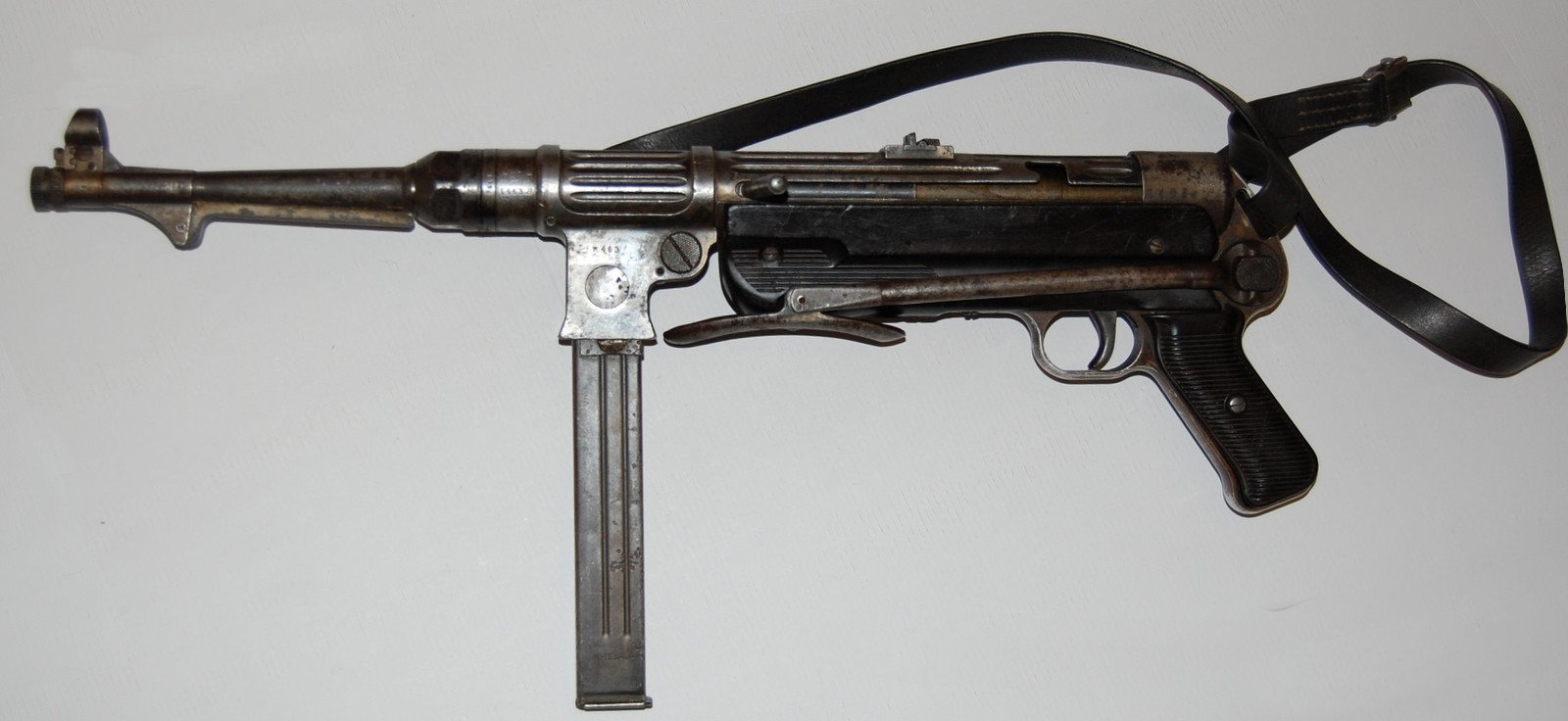 Figure 6 — An MP 38 in profile, stock extended. Externally the silhouette is the MP 40's, which is why the two are confused in photographs so persistently.