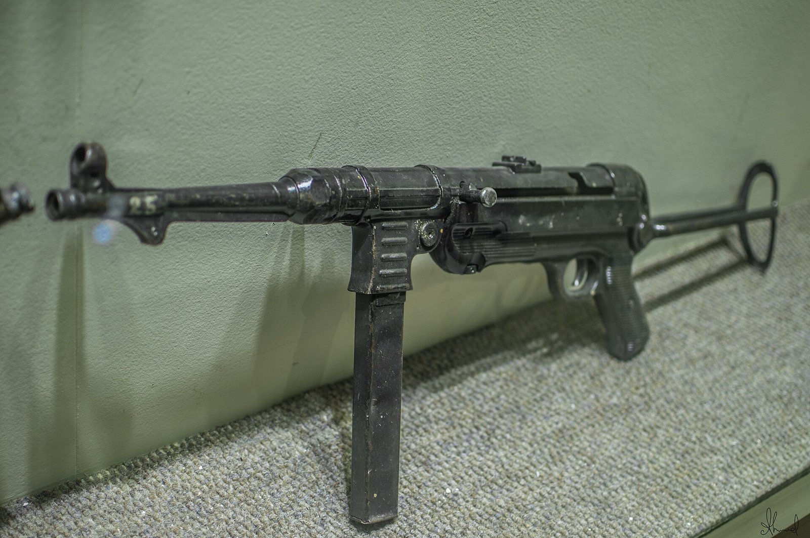 Figure 4 — An MP 40 photographed side-on. This is the view that shows receiver deformation: a rolled sheet tube should run straight and round from the rear of the receiver to the barrel collar, and any wavine…