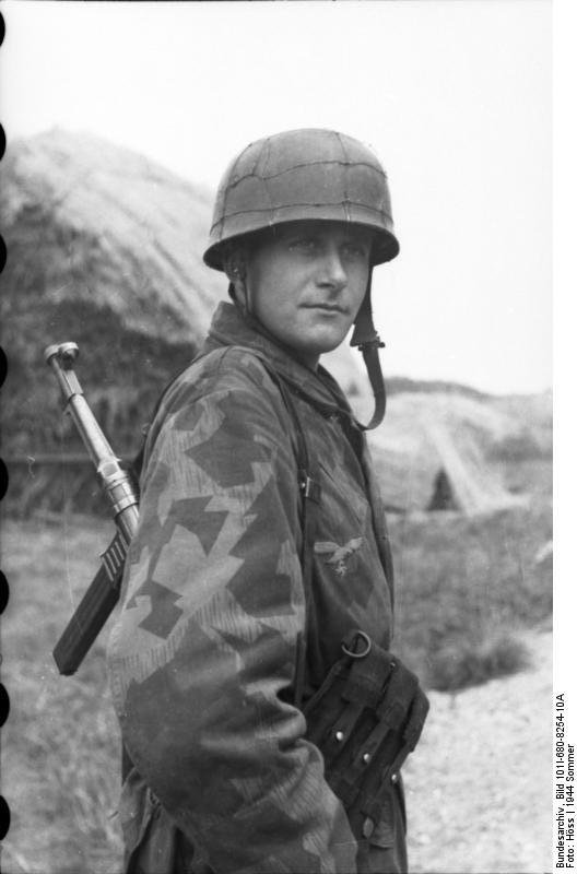 Figure 2 — A Fallschirmjäger with the MP 40 slung. The weapon travels well on a man who has other things to carry and other ways to move.