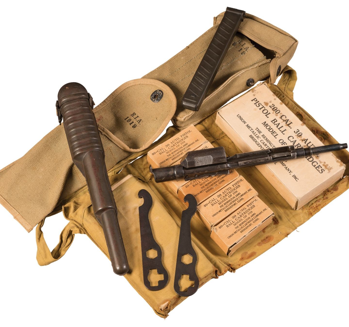 Figure 2 — A surviving outfit with five original boxes of Model of 1918 ball cartridges, the device, its scabbard, the two wrenches and the canvas bandoleer. Rock Island Auction Company, 27 August 2022, lot 1…