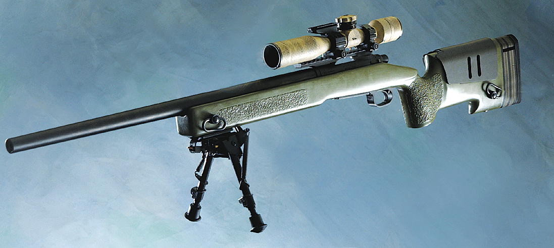 Figure 1 — The M40A3 as the Corps introduced it: a Marine Corps photograph of 25 September 2003 captioned "the new precision fire weapon used by Marine snipers". The McMillan A-4 stock with its adjustable sad…