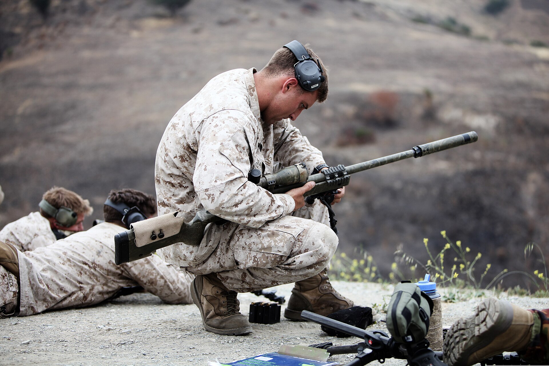 Figure 8 — A photograph on Wikimedia Commons whose file name calls the rifle an "M40A2" — a designation that was never issued. The photograph's own description, from the Marine Corps, says M40A5: a suppressed…