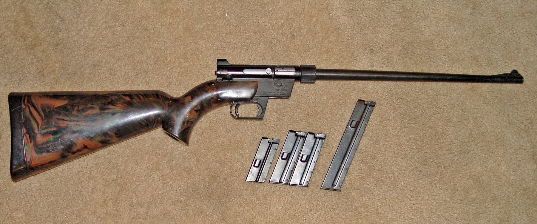 Figure 4 — An ArmaLite AR-7 Explorer, the other 1959 American .22 with a plastic stock. Its bolt runs in a die-cast metal receiver inside the stock, so the plastic carries no working surfaces; Simmons made th…