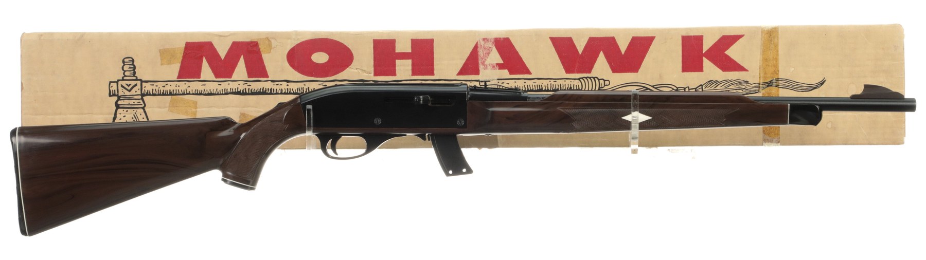 Figure 4 — The Mohawk 10C's carton, printed MOHAWK with the line "Sporting Firearms of Quality". The 10C was the box-magazine successor to the Nylon 77 and, according to Simmons, "a promotional rifle offered …