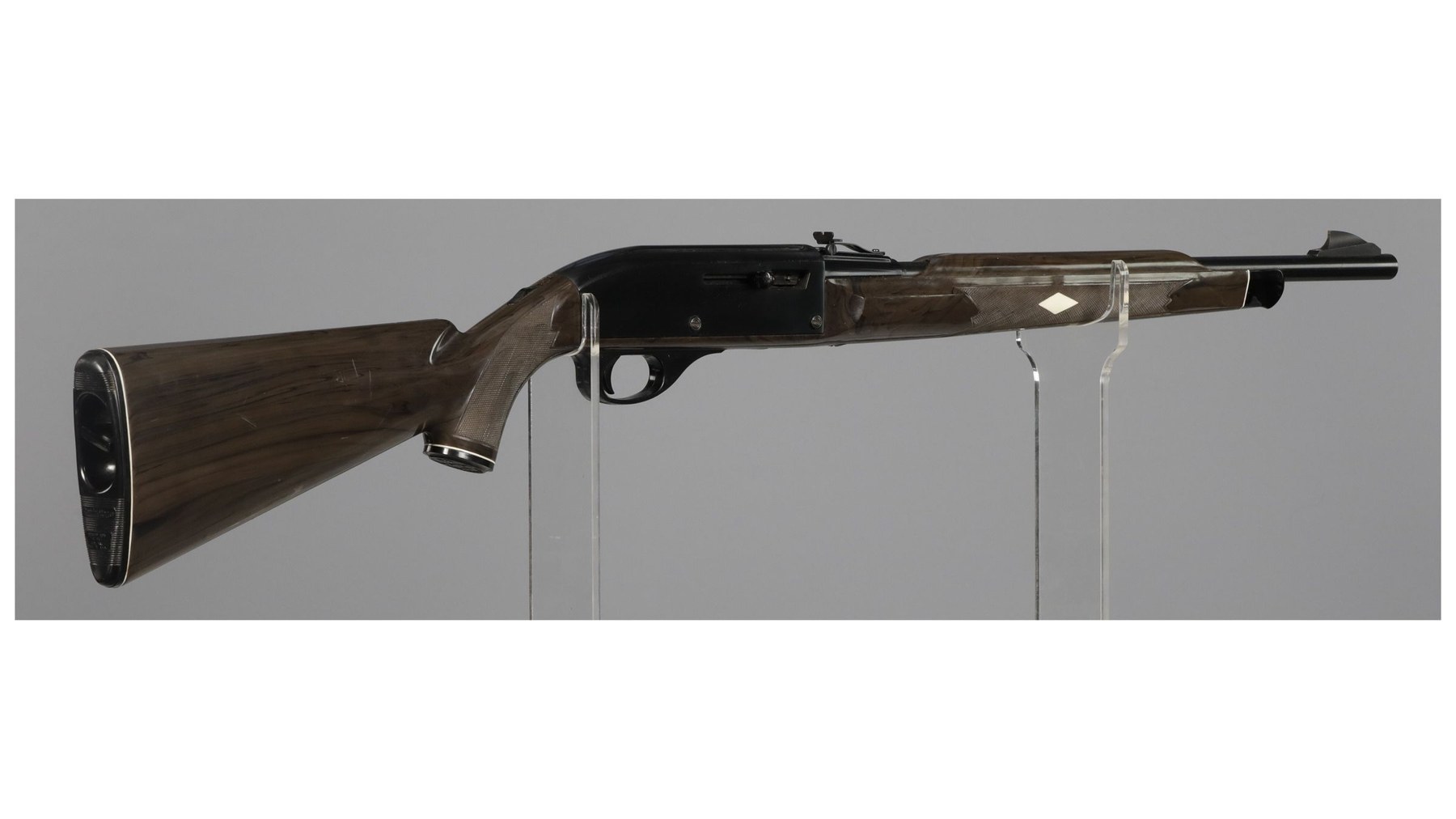 Figure 4 — A Nylon 66 that Rock Island Auction catalogued as "Manufactured in 1959", the first production year, seen from the right side. The blued steel cover, the rear sight riveted to it and the white diam…