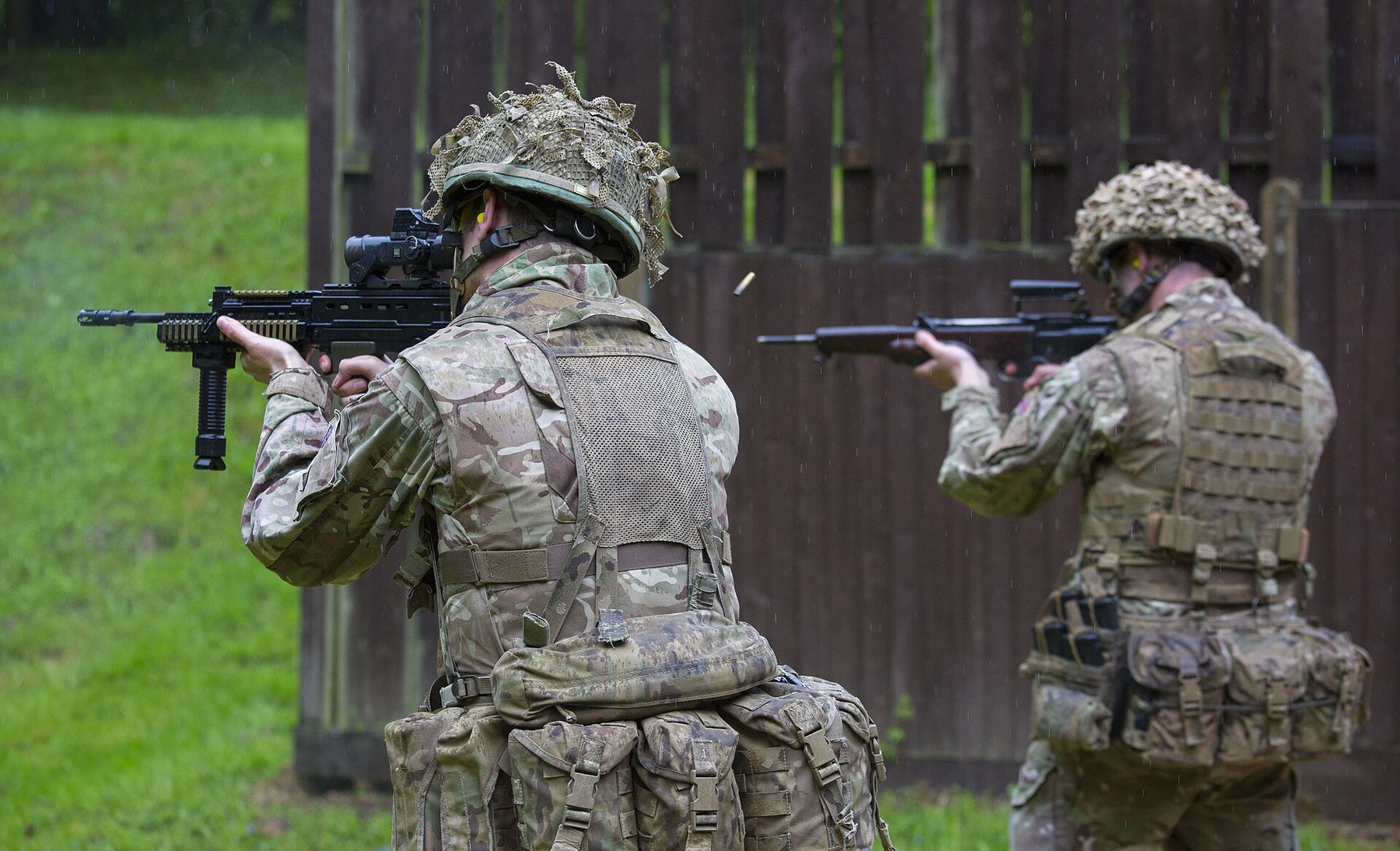 Figure 6 — An EM-2, right, and an SA80-A2, left, fired side by side on a range in 2016. MOD photograph by PO Phot Owen Cooban, Open Government Licence v3.0.