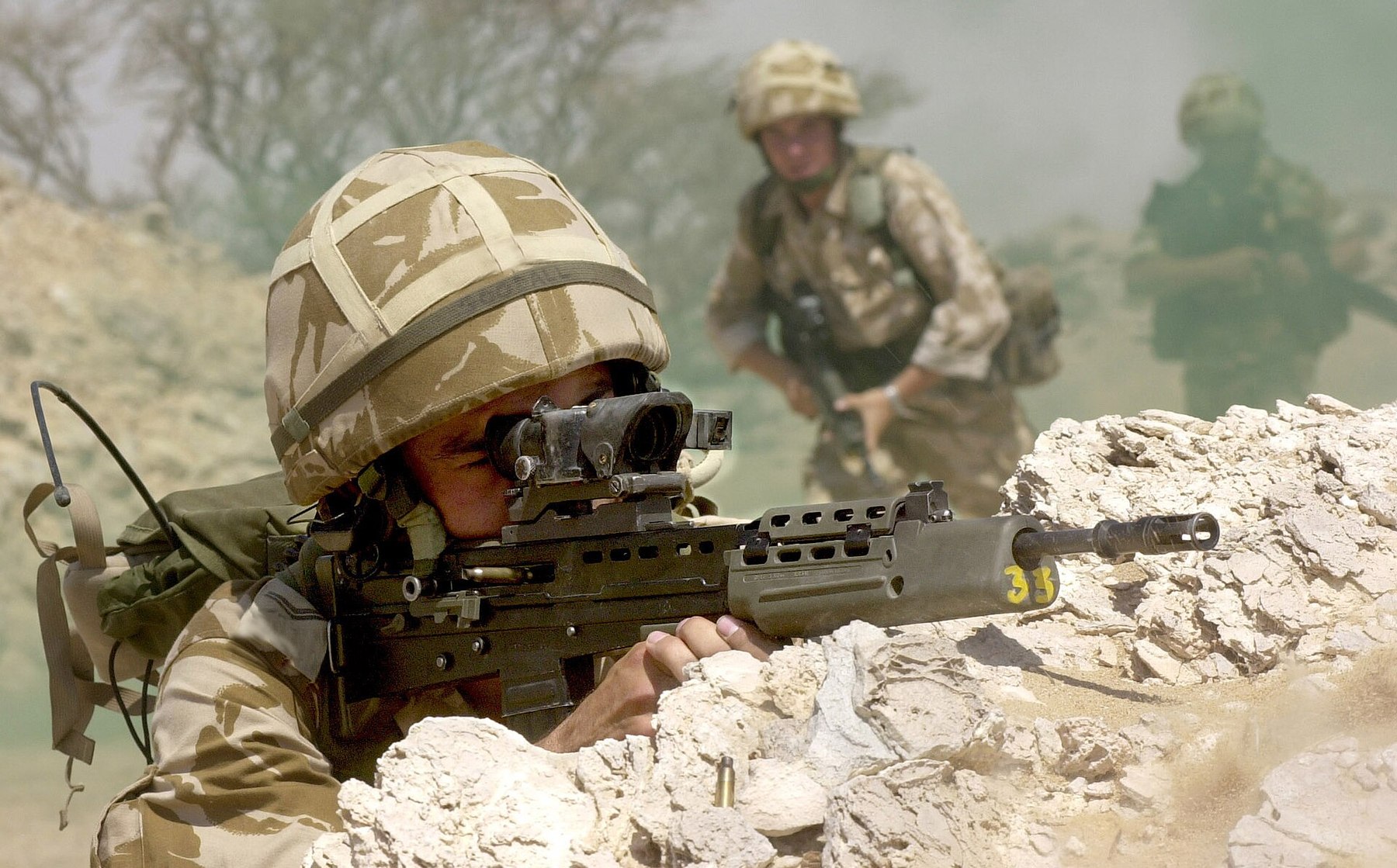 Figure 10 — A British soldier with an SA80 rifle on Exercise Saif Sareea II in Oman, 2001: the desert exercise in which, a member later said, the rifle's problems had again appeared. Photograph by WO2 Pete Bri…
