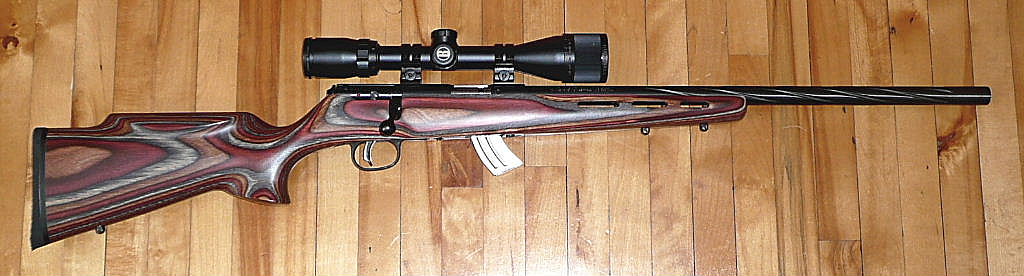 Figure 3 — A Savage Mark II BRJ in .22 LR with a laminated stock and a scope fitted. The Mark II is the small-action sibling of the Model 93, which Savage handles as the same mechanism sized for the longer .2…