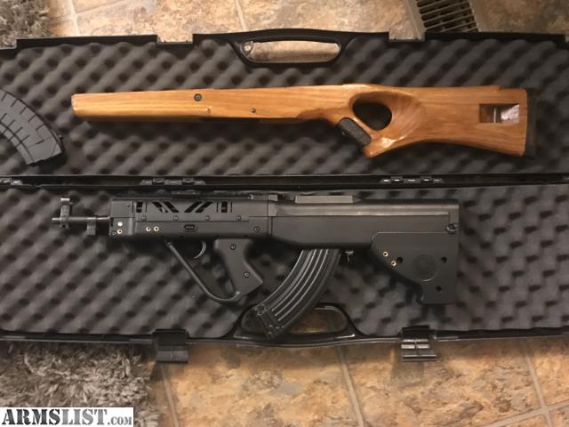 Figure 9 — A cased bullpup kit, original stock included. That habit — every kit shipping with the factory furniture kept — is worth copying.