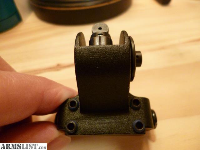 Figure 3 — A Tech-Sights aperture unit. It mounts to the factory rear sight base and needs no drilling, which is the whole appeal.