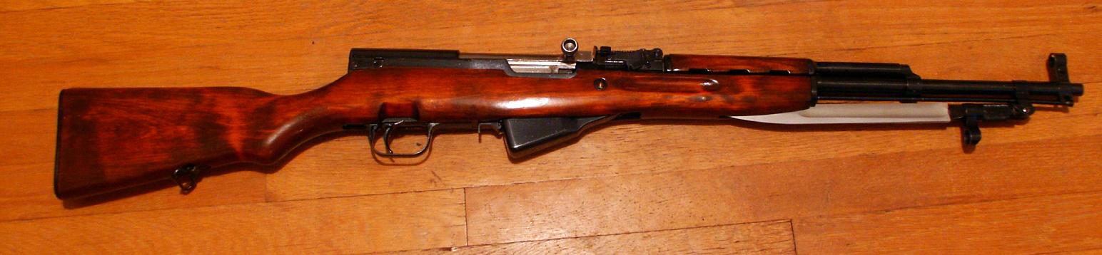 Figure 3 — The same rifle from the right. The bolt handle slot in the receiver is the only opening in an otherwise fully enclosed action — the feature the 1953 CIA source described as "completely covered from…