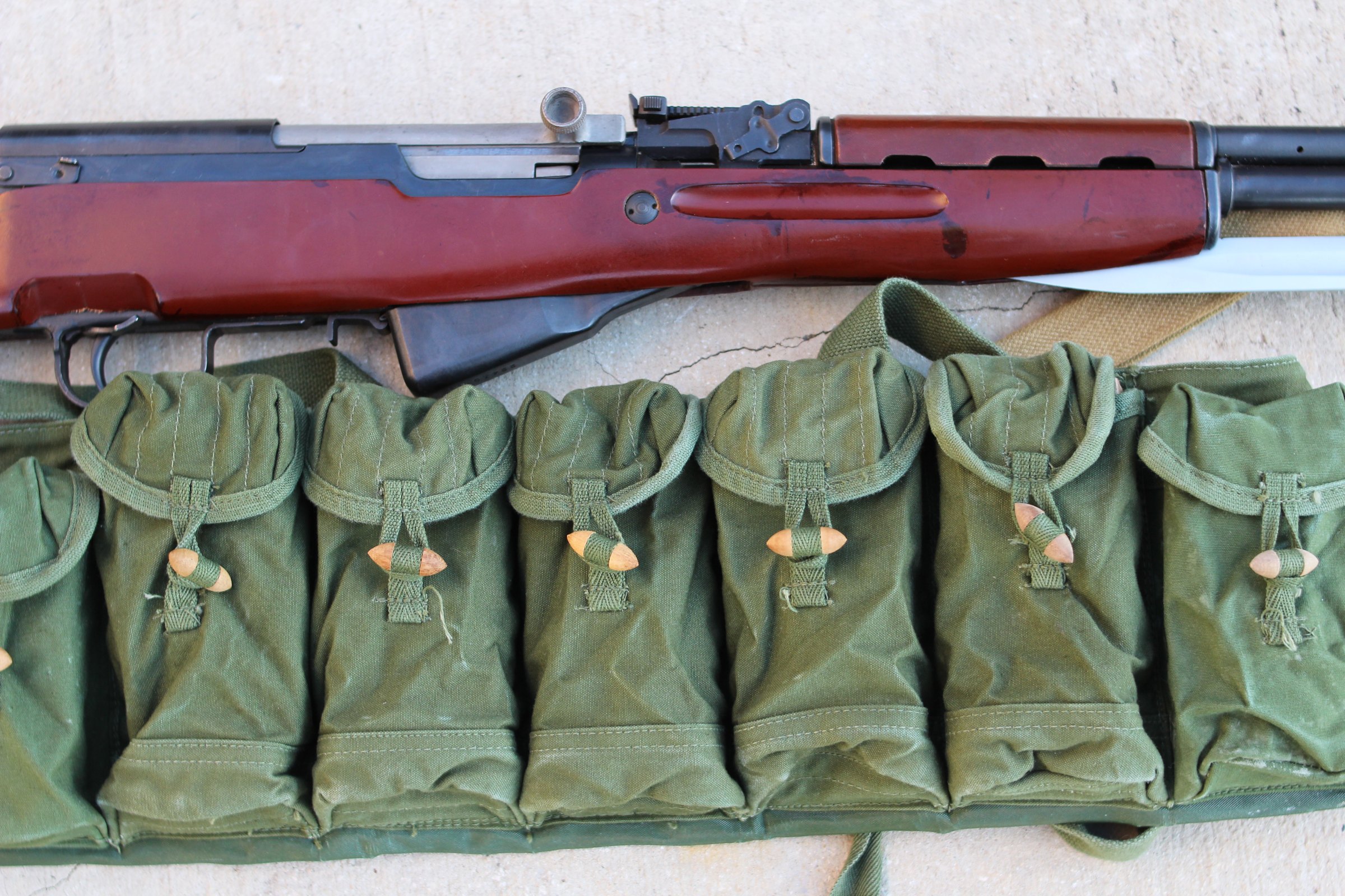 Figure 10 — A Chinese Type 56 in its original wood with the chest rig. There is an argument for leaving one alone, and this is it.