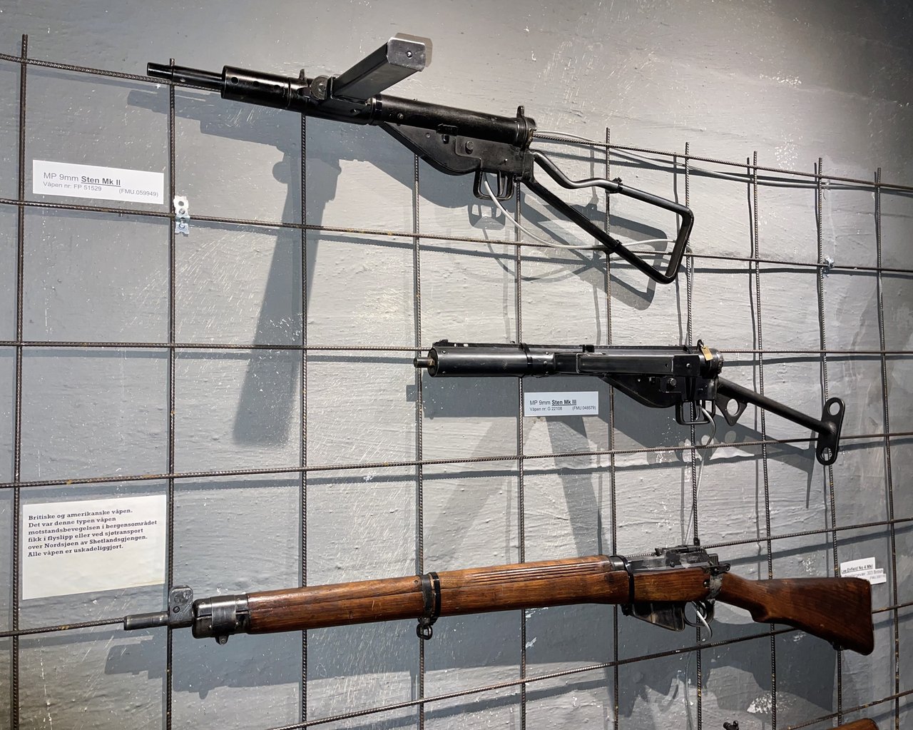 Figure 2 — 6.2 — A WWII Norwegian Hjemmestyrkene (Home Forces / resistance) STEN Mk II / Mk III collection display at Bergenhus Festningsmuseum (Bergen Fortress Military Museum), Norway, alongside ot…