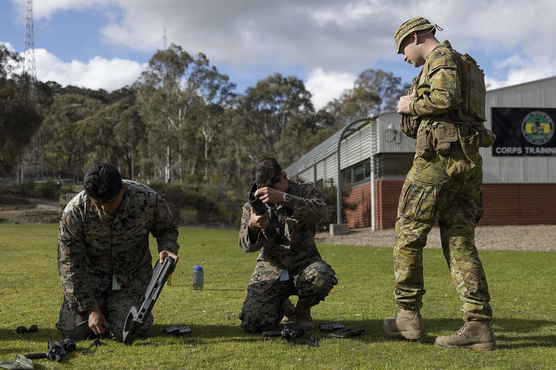 Figure 3 — A US Marine with an EF88 partly stripped during a familiarisation class hosted by Australian soldiers in 2023. Photograph: US Marine Corps, public domain.