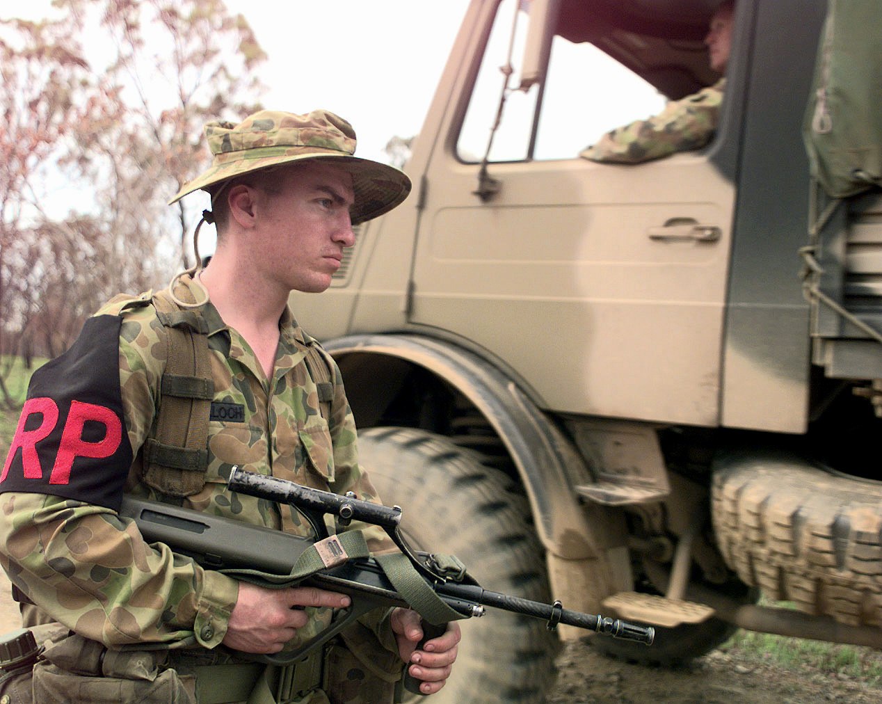 Figure 5 — A private of the 9th Battalion, Royal Queensland Regiment, with an F88 at a checkpoint during exercise Crocodile '99 at Shoalwater Bay, 1999. Photograph: PH1 Daniel E. Smith, US Navy, public domain.