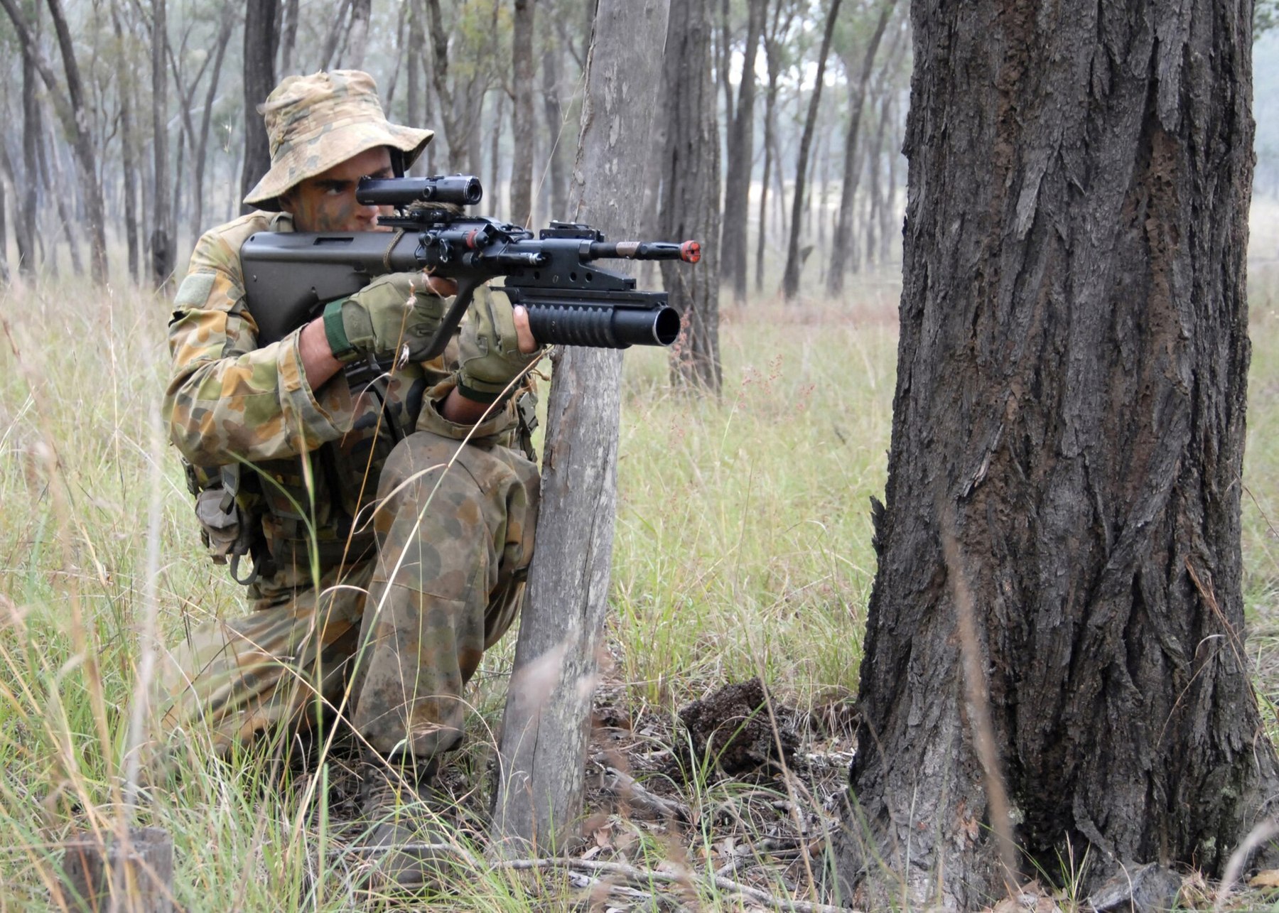 Figure 7 — An F88 GLA with an M203 grenade launcher in action during Talisman Sabre 2007. Photograph: MC1 James Foehl, US Navy, public domain.