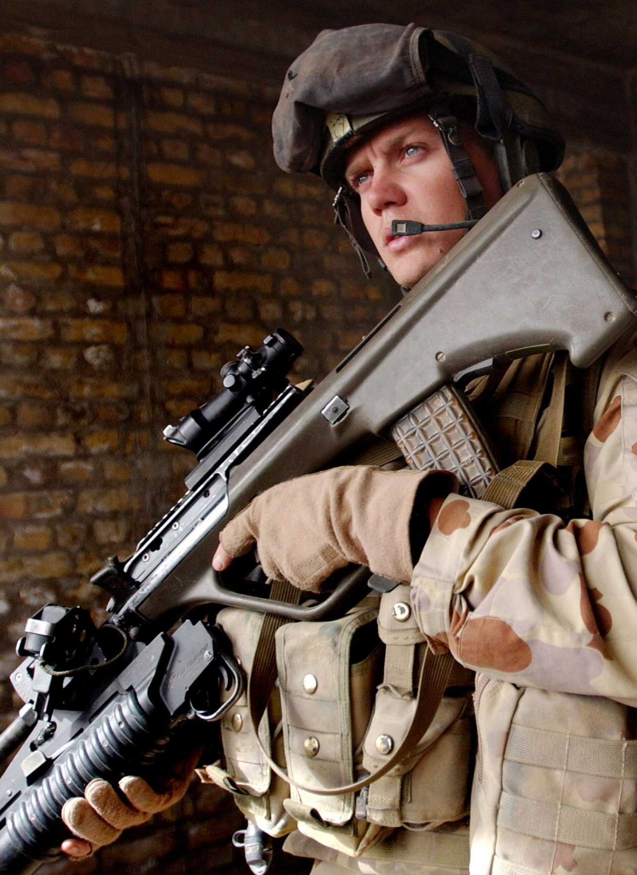 Figure 8 — A soldier of the 3rd Battalion (Parachute), Royal Australian Regiment, in Tarin Kowt, Uruzgan, in August 2008, carrying a railed F88 with a grenade launcher. Photograph: isafmedia, CC BY 2.0.