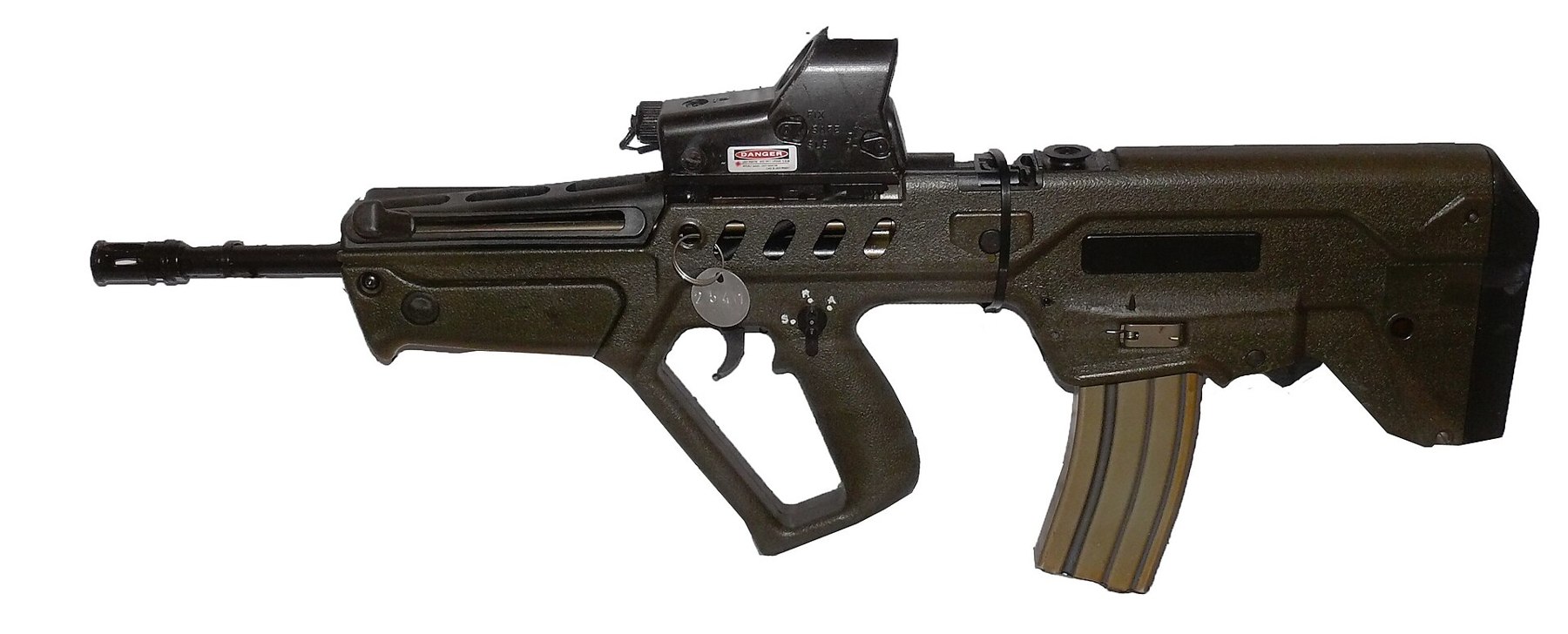 Figure 8 — Not an AUG: an IWI Tavor TAR-21. It is a bullpup with the magazine behind the grip and a full trigger guard, but the barrel is enclosed in a long polymer handguard with no folding vertical grip, th…